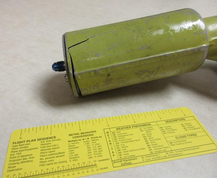 Actuator fatigue crack, with ruler for scale