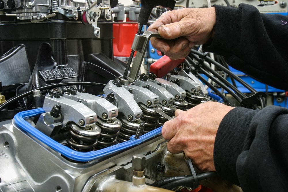 Automotive valve springs and lifters in an engine head